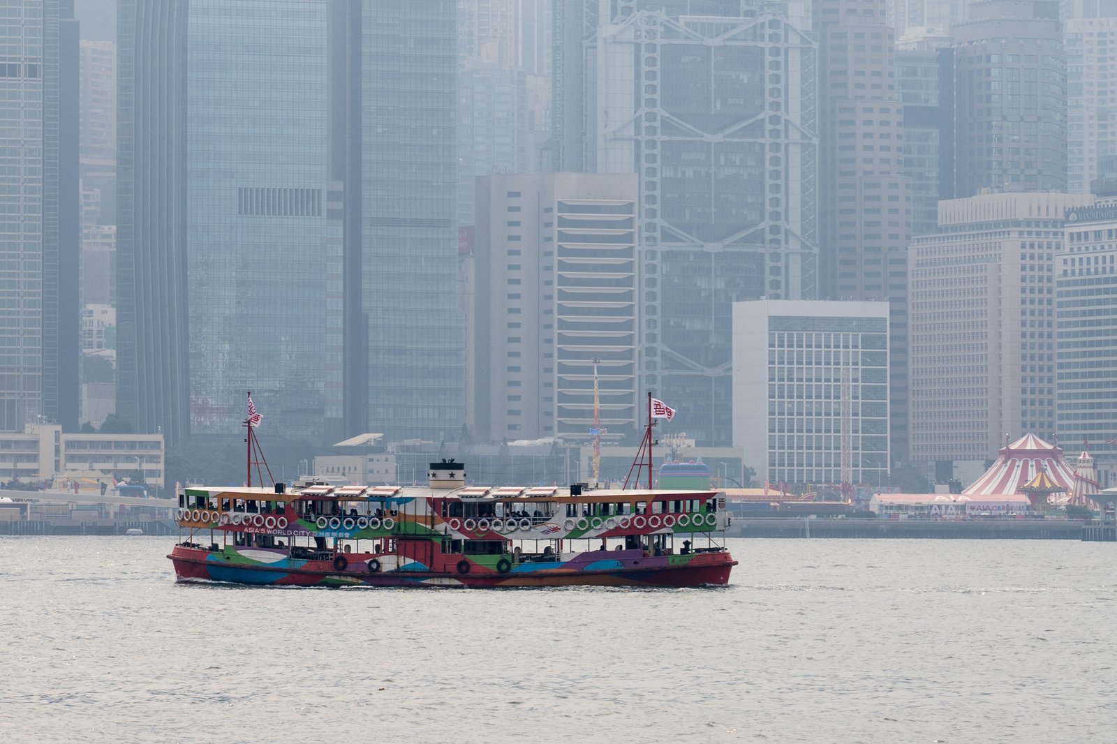 A Star Ferry crossing Victoria Harbour in Hong Kong, with the island skyline behind